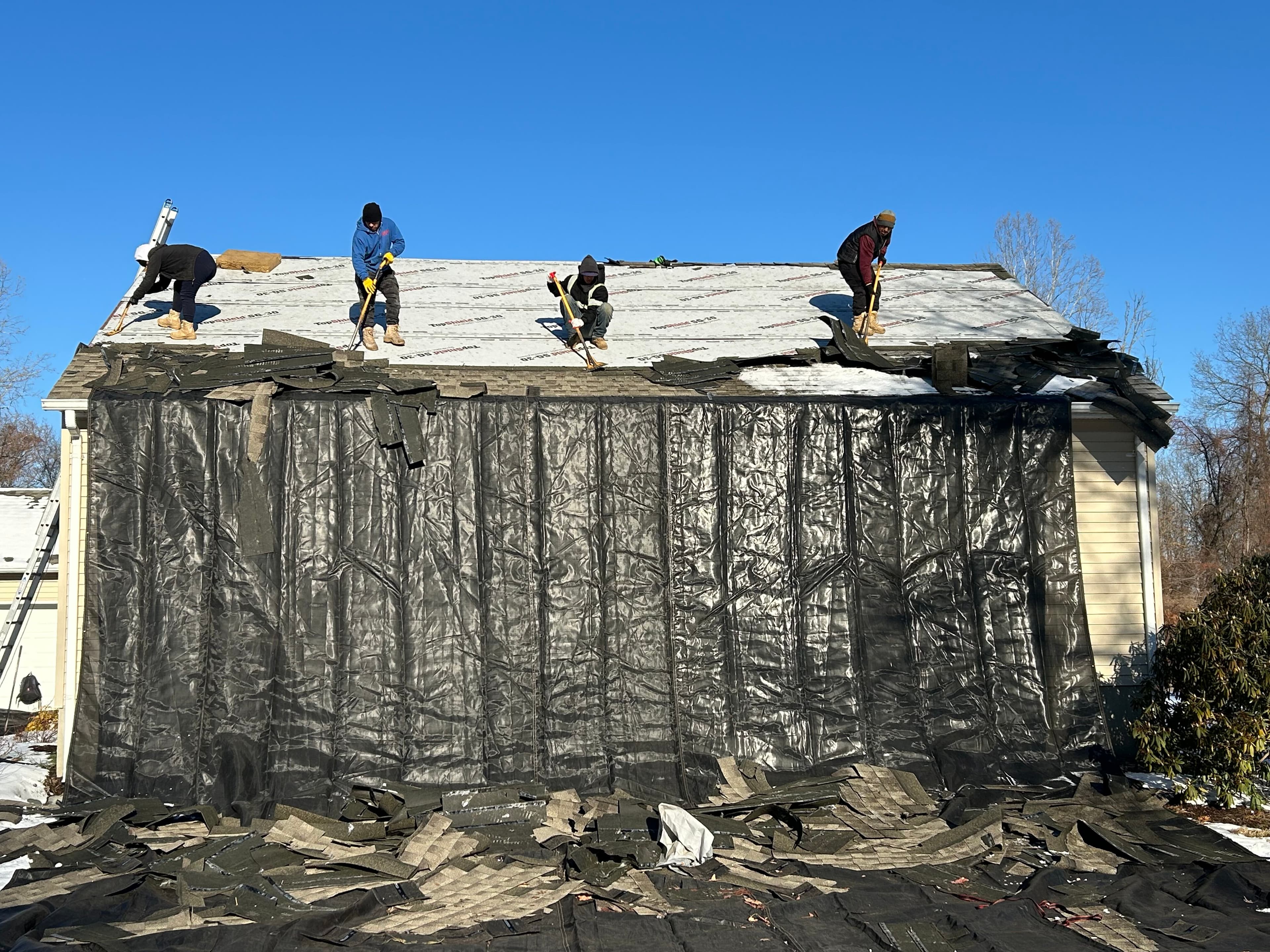 Roofing crew working on NJ residence