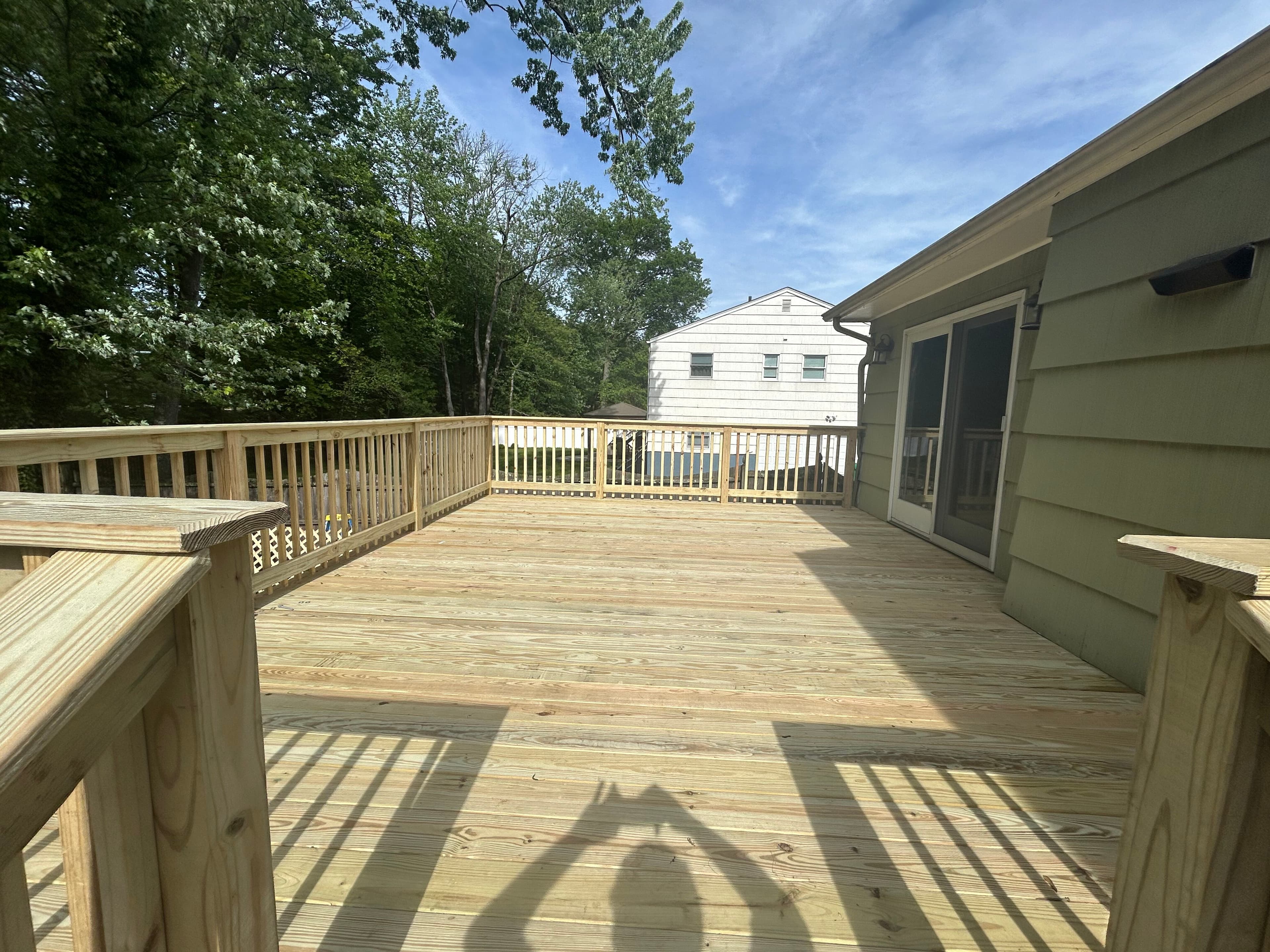 Pressure-treated deck completion