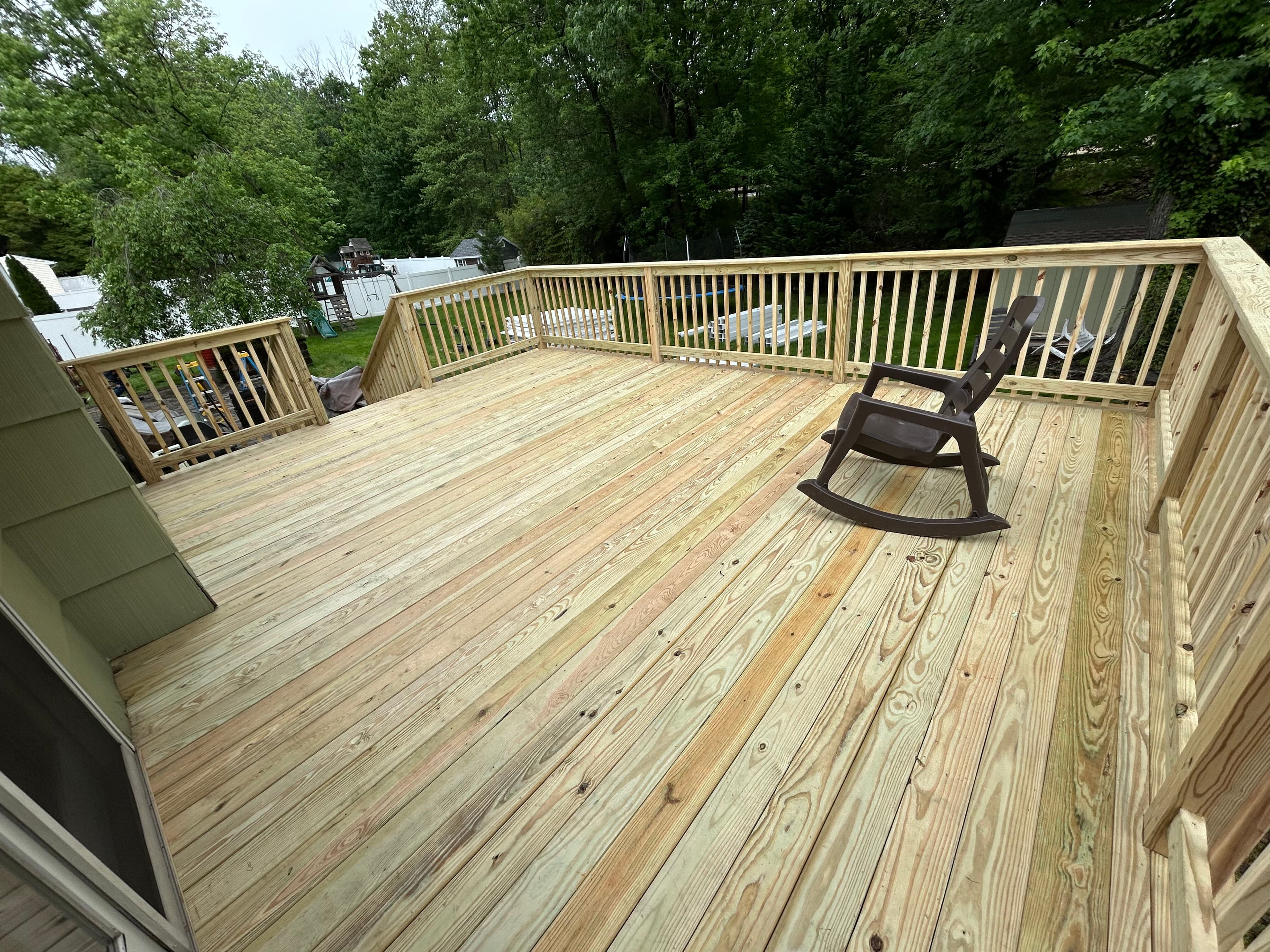 Lakefront wood deck installation