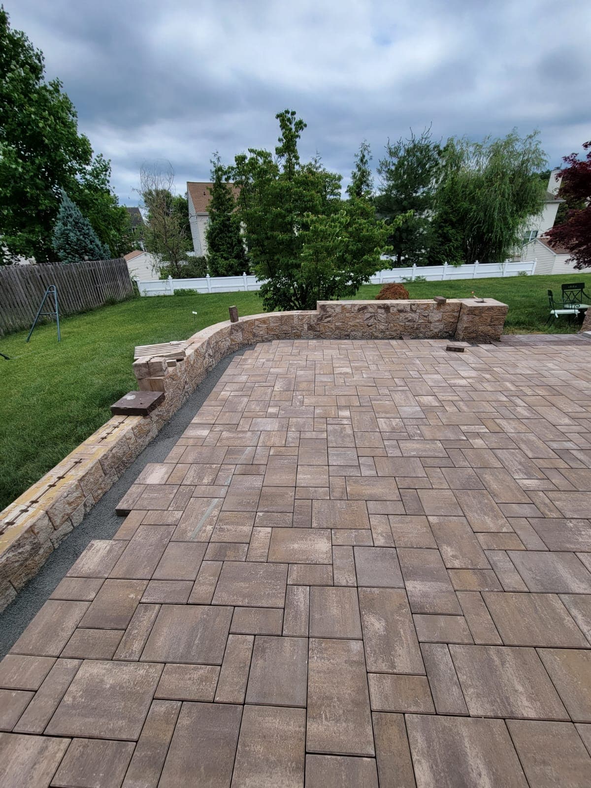 Completed paver patio with seating wall